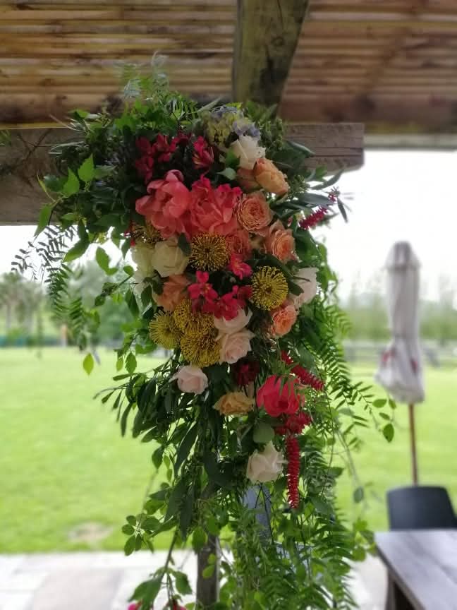 Kin Florist wild, romantic wedding arch floral arrangement with airy delicate foliage, for a Matakana wedding at The Stables.