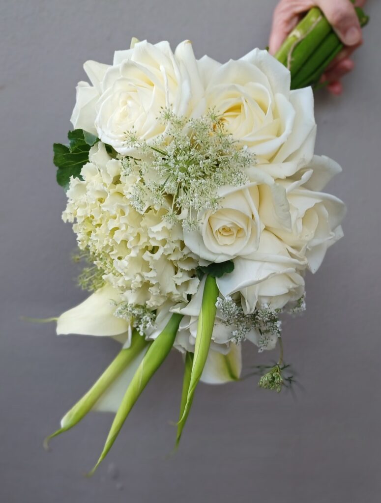 Kin Florist wedding bouquet in Matakana. Minimalist white florals. Romantic cottage garden.