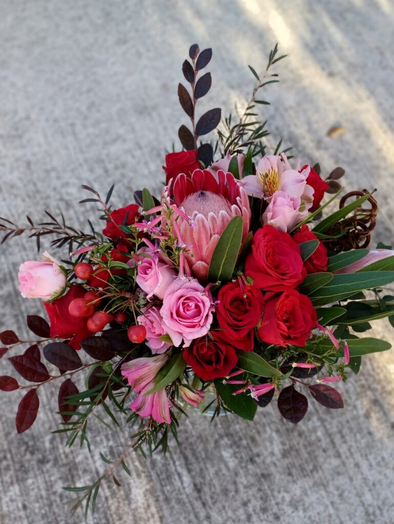 Kin Florist wild wedding bouquet, Matakana. Romantic, rustic red and pink modern bouquet.